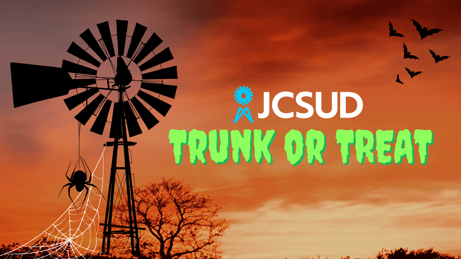 JCSUD Windmill with a sunset behind it, with the words Trunk or Treat