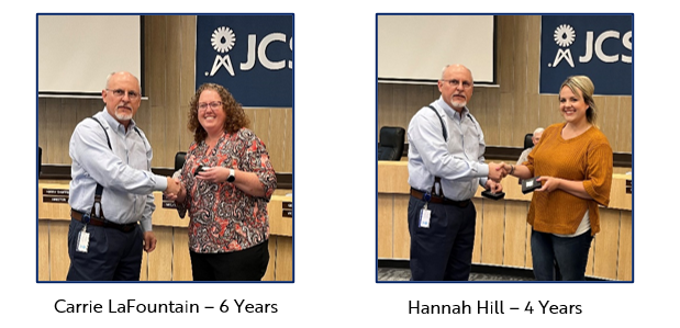 Staff members being presented with awards